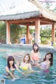 A group of young women in a swimming pool.